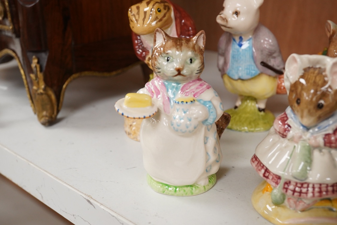 Twenty Beatrix Potter figures, mostly later production figures, largest 11cm high